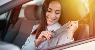 leasing-returns Young woman sits in her company car